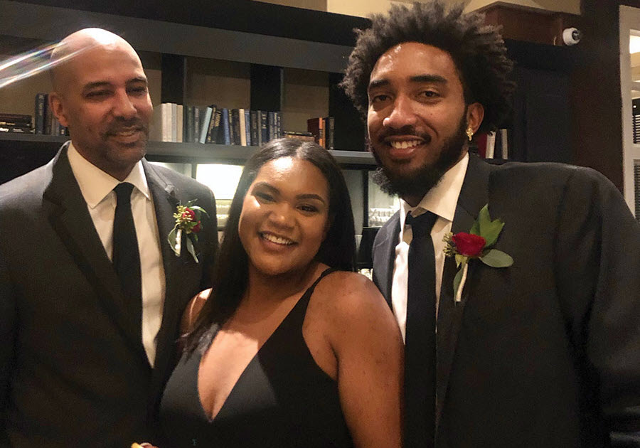 Leila Abe celebrates with her father and brother