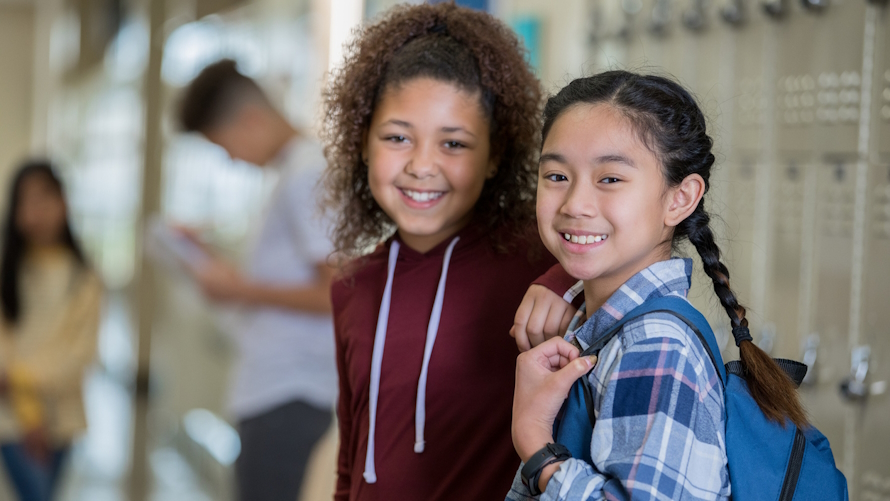 Two middle school girls smiling