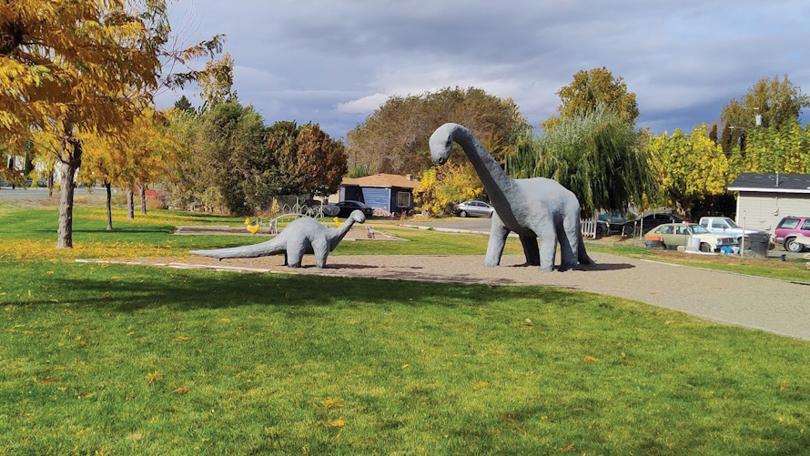 Two large dinosaurs in a park in Granger, Washington