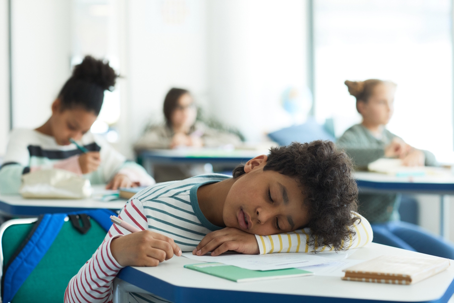 kid falling asleep in class at school