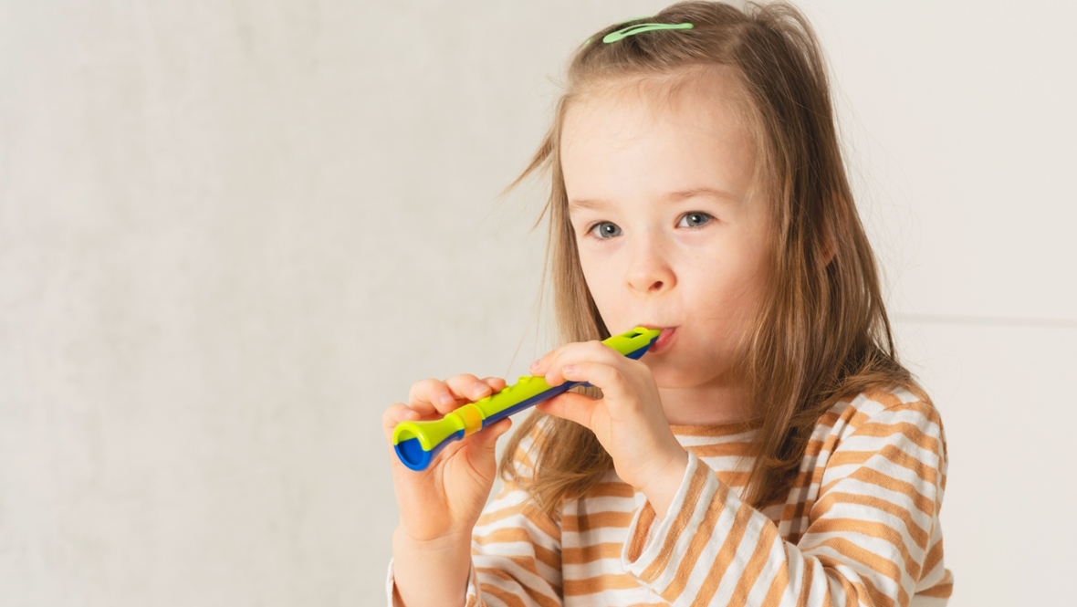 girl playing a whistle