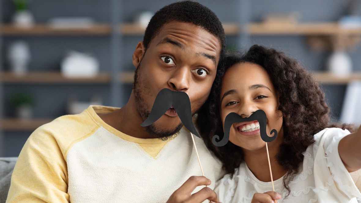 dad and daughter with paper mustaches