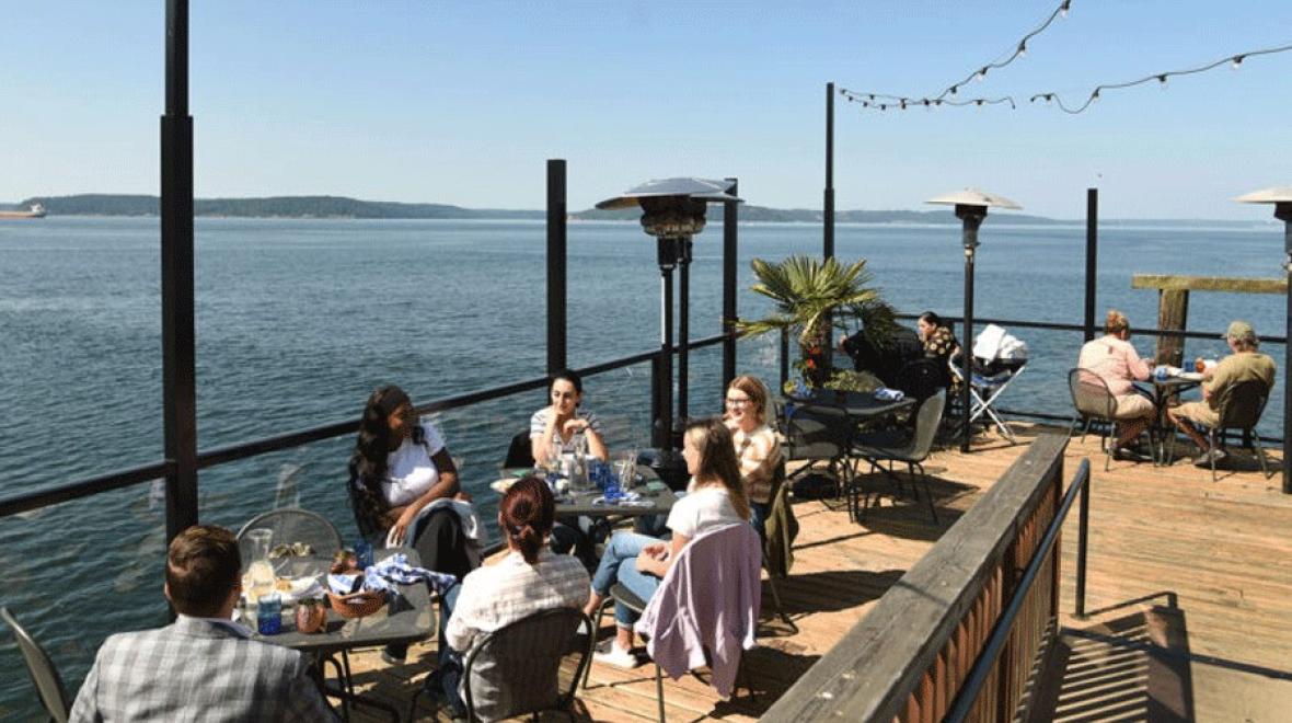 families enjoying a waterfront meal at Duke's restaurant in Tacoma