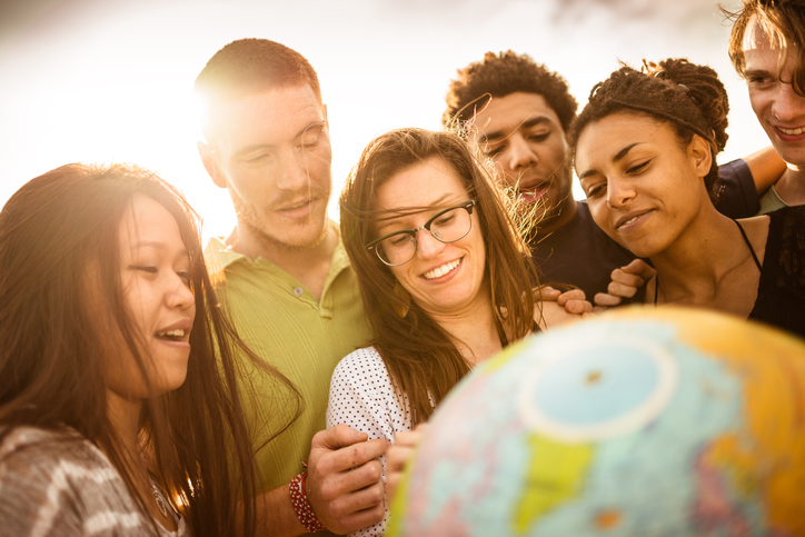 Teens with globe