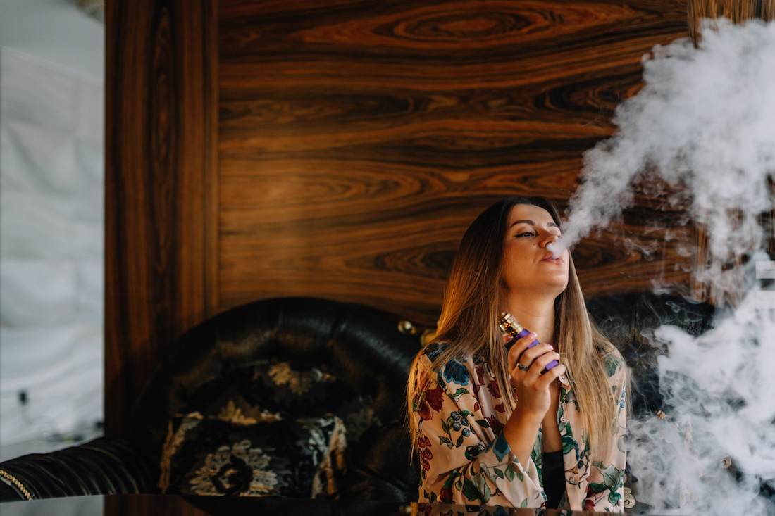 woman smoking cannabis at home