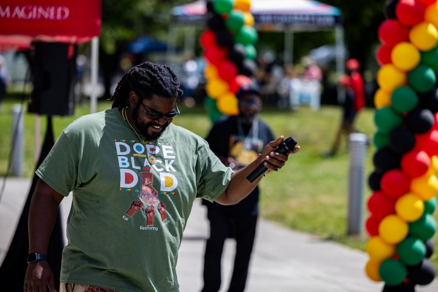 A dad shows support for the community and enjoys Juneteenth fun in Auburn.
