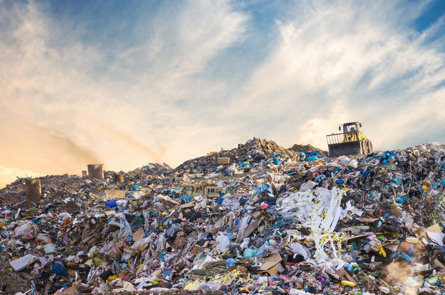 A large landfill with trash and lots of food waste