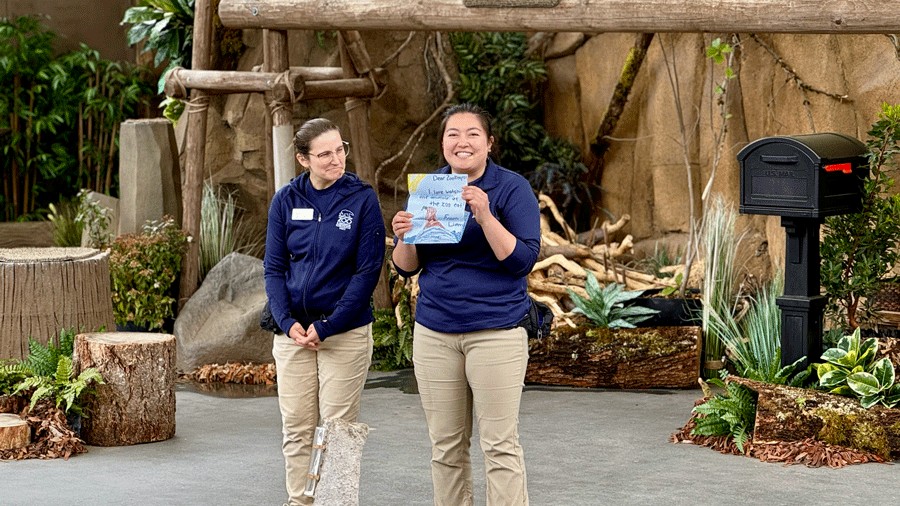 zoo biologist holding a children's letter with a question for the Wild Wonders Outdoor Theater Show