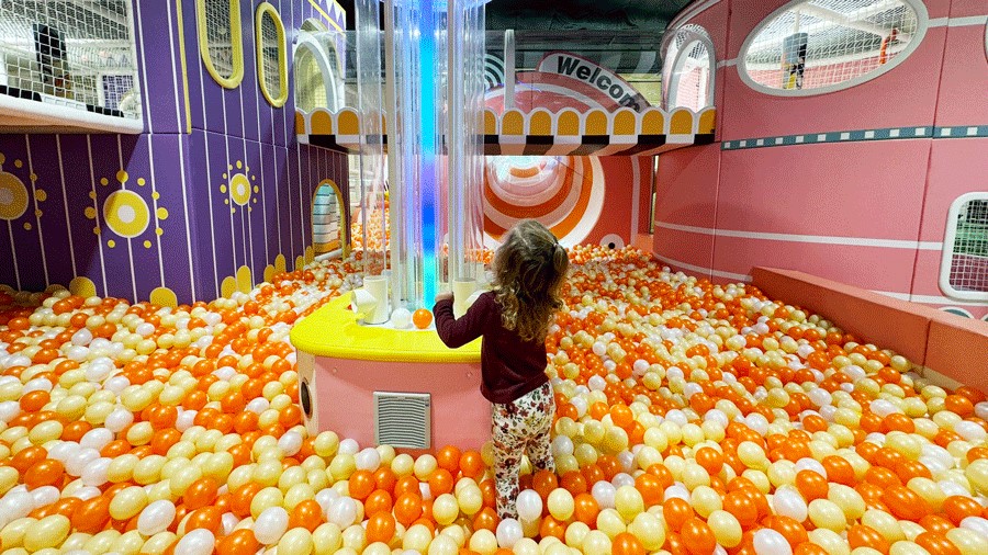 Young girl playing at Twinkle Land Play Cafe, an indoor playground near Seattle, one of many fall activities for families