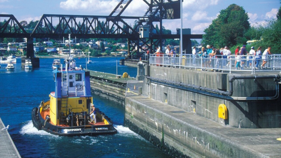 A boat passes through the Ballard locks along the Burke-Gilman trail
