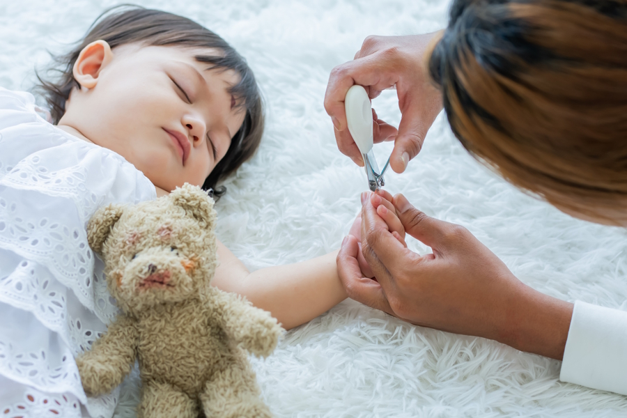 mom cutting baby nails baby essentials you will need