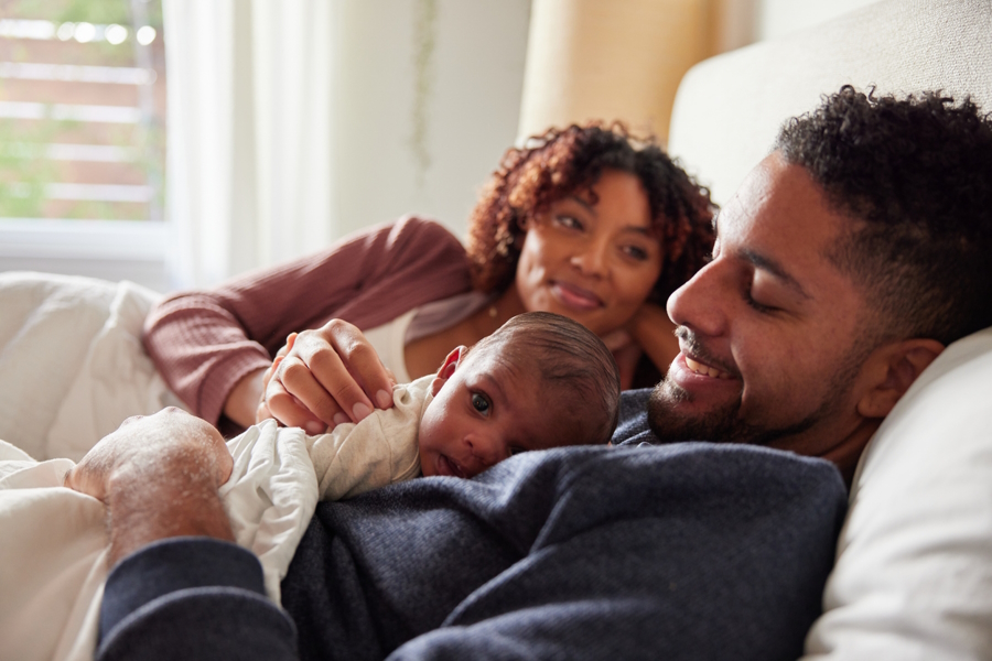 Young couple with new baby essentials you will need