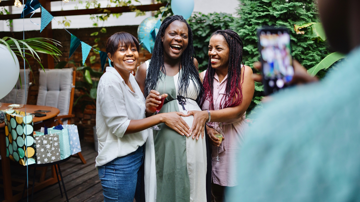 women smiling and having fun at a baby shower