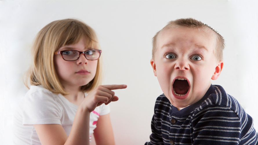 Young girl and young boy pointing