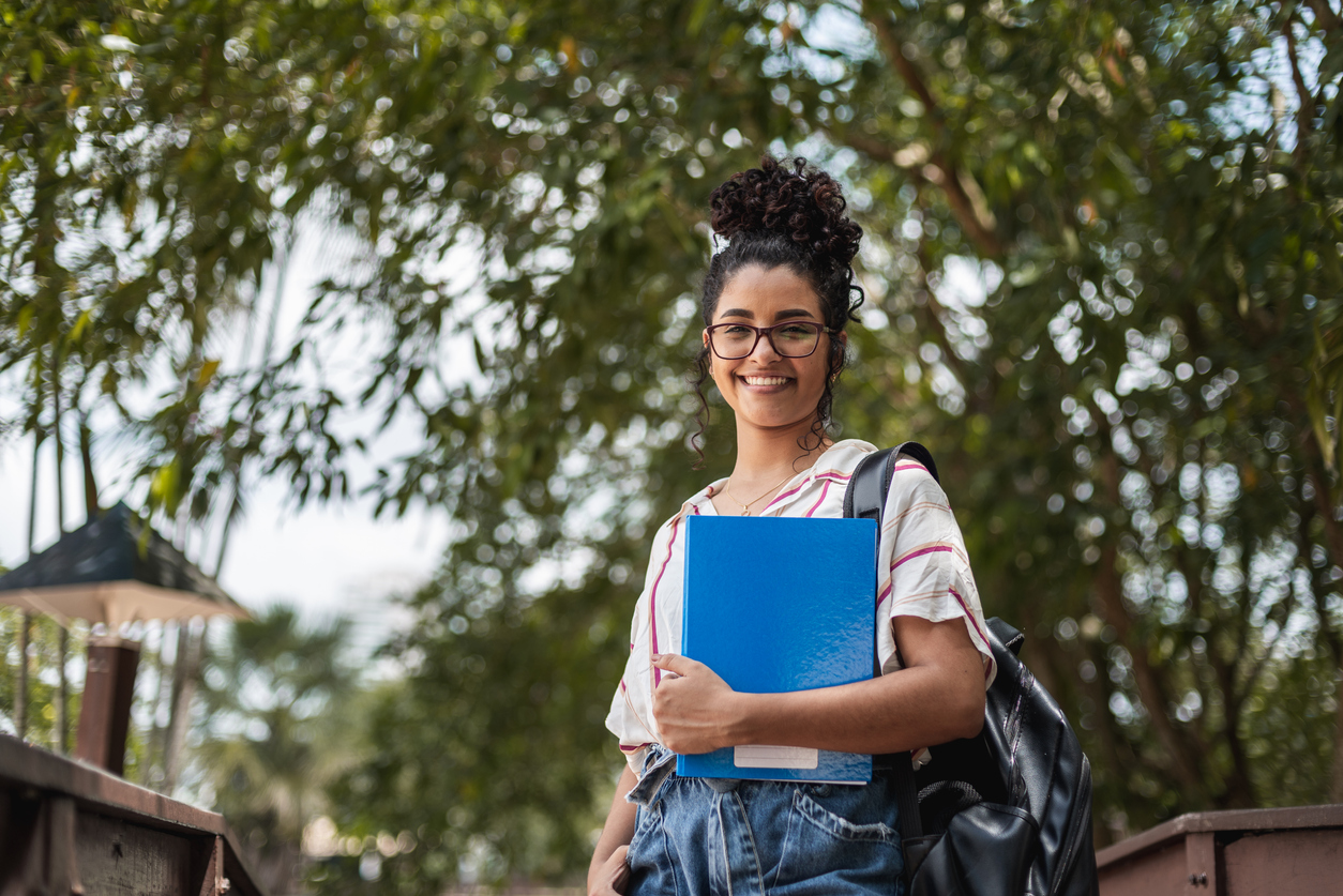A confident young woman on a college campus