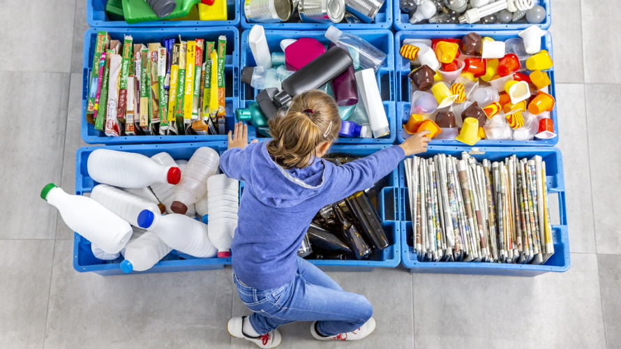 Kid-organizing-recycled-items