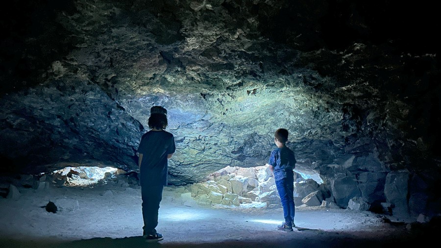 Kids exploring the Redmond Caves, an outdoor activity for families near Sunriver,Oregon