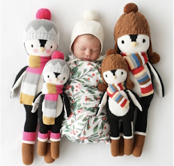 Baby sleeping with Everest the Penguin around them