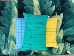 Green, blue and yellow library card pillow