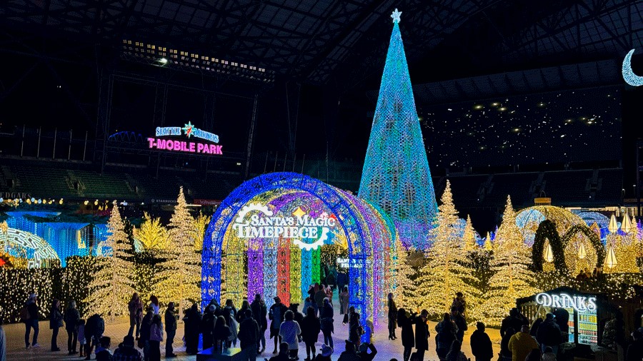 Enchant Christmas light maze entrance with Santa's Magic Timepiece theme, a holiday event in Seattle for families
