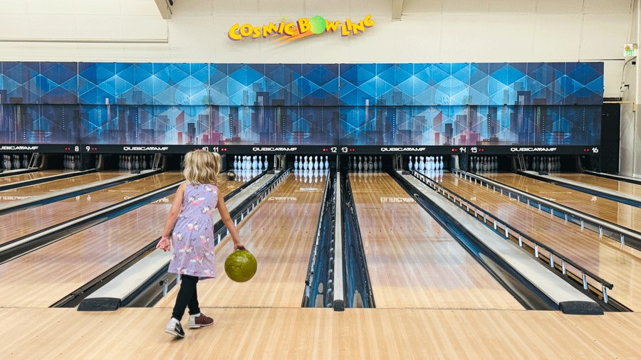 girl bowling at Spin Alley Bowling, a place for retro fun
