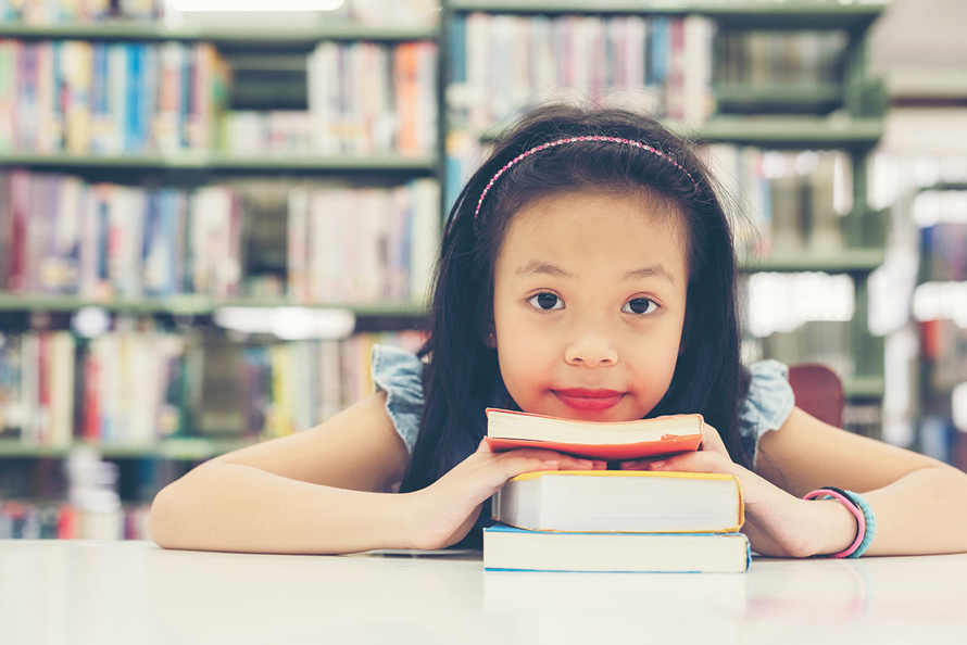 little girl with books