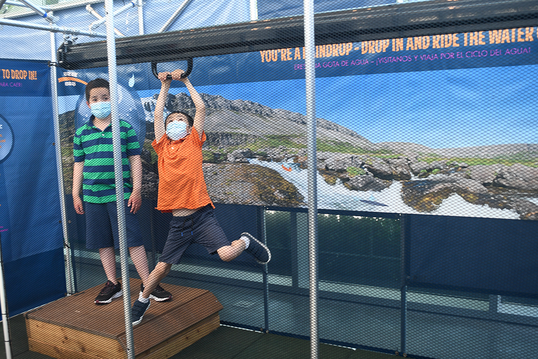 Boys play in the Water’s Extreme Journey new exhibit at Seattle’s just-reopened Pacific Science Center