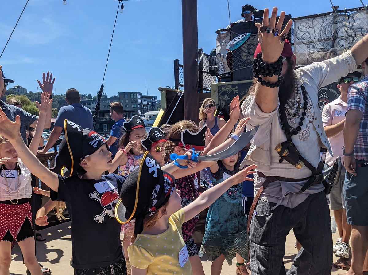 Young kids aboard Emerald City Pirates’ Family Treasure Cruise learn to be true scallywags from their pirate guides