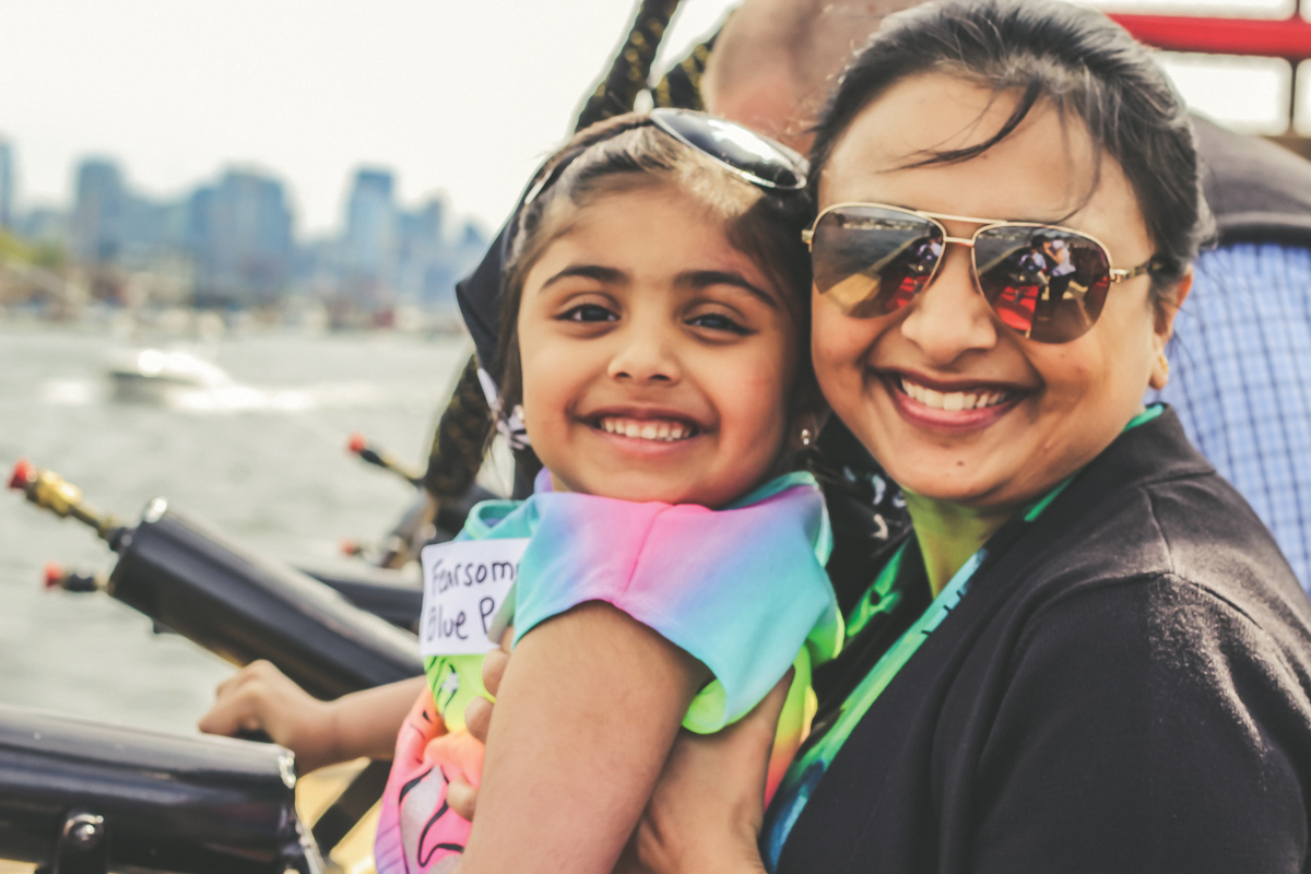 Emerald City Pirates run a pirate-themed seattle boat tour, girl smiling on the ship