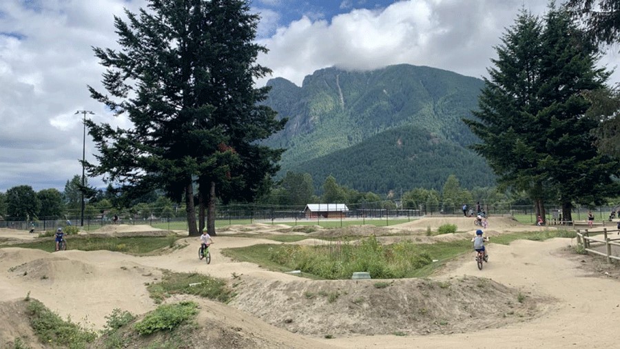 Kids riding the pump tracks at Torguson Park in North Bend, a Seattle-area pump track