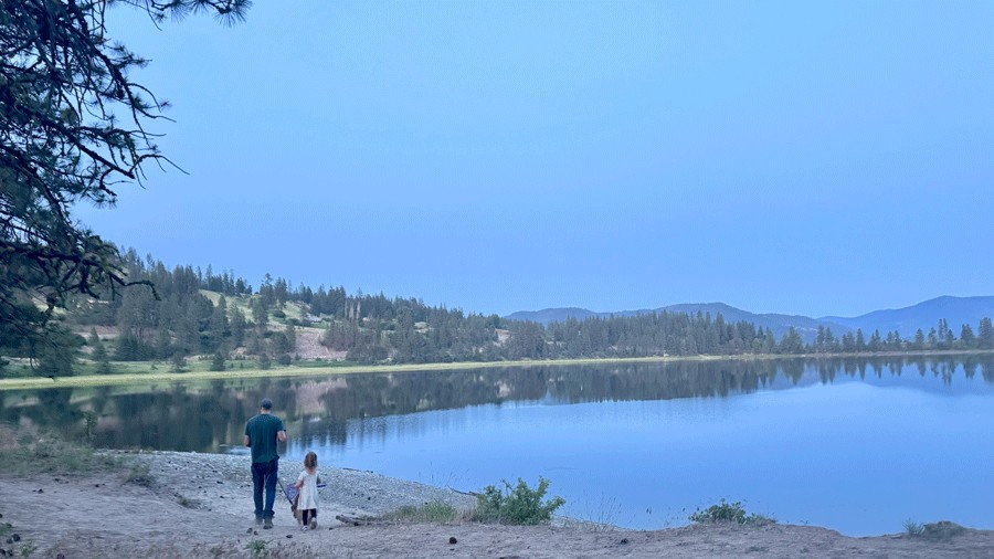 family walking to the river at a RV Resort near Kettle Falls, Washington on a campervan trip
