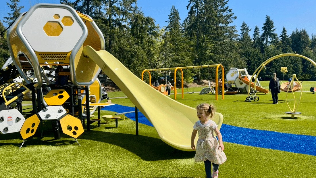 young girl on a newly renovated playground in Bellevue at Hidden Valley Park