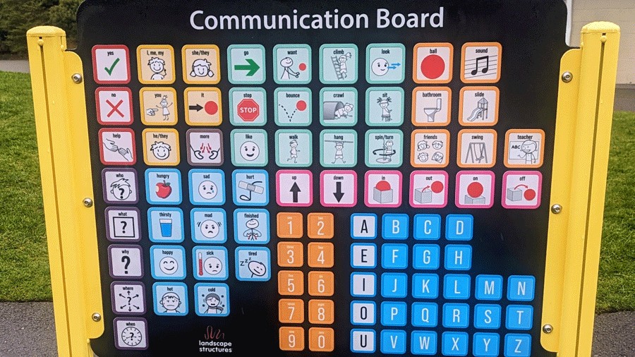 inclusive playground design in Bellevue with communication board for nonverbal children