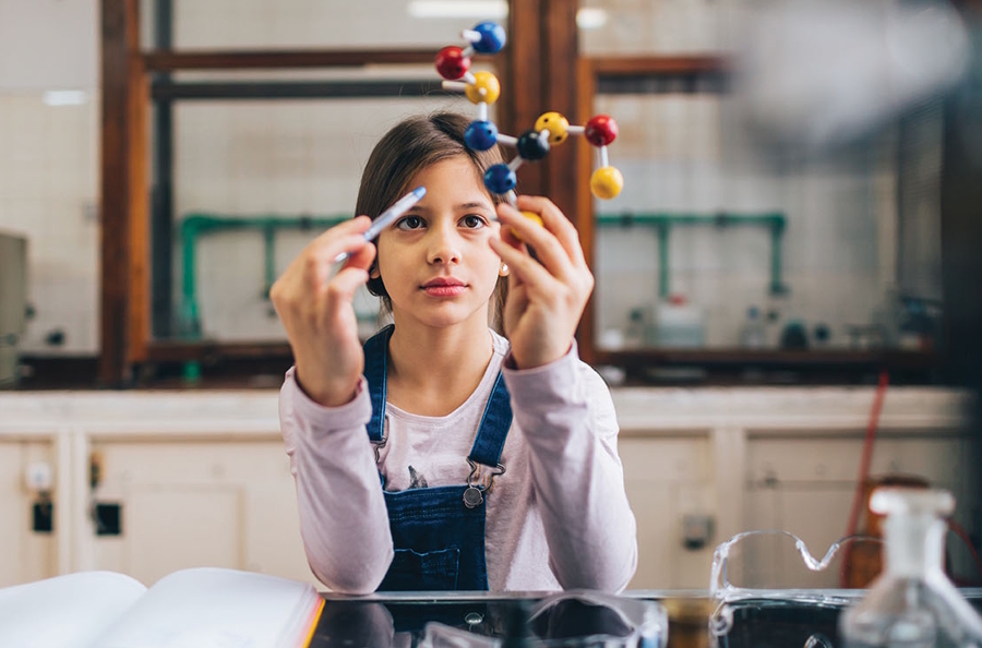 Girl in a hands-on science class