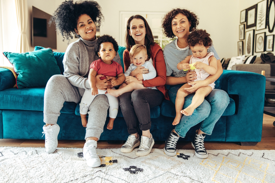 moms sitting together with babies