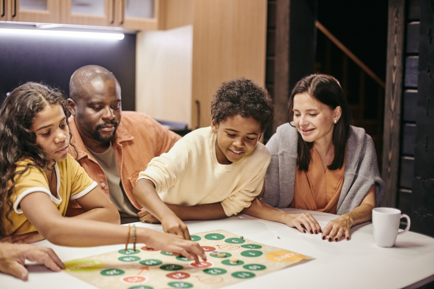 Family playing a board game together