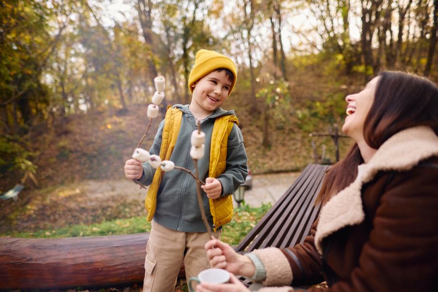 son and mom with marshmallows camping