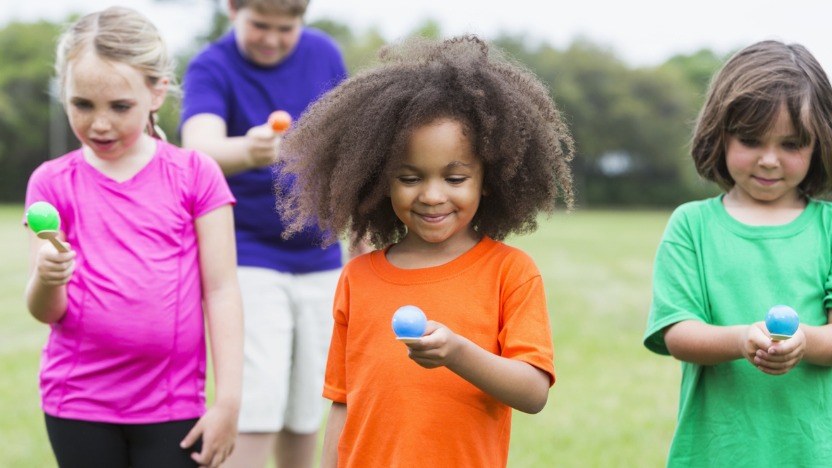 kids in an egg and spoon race