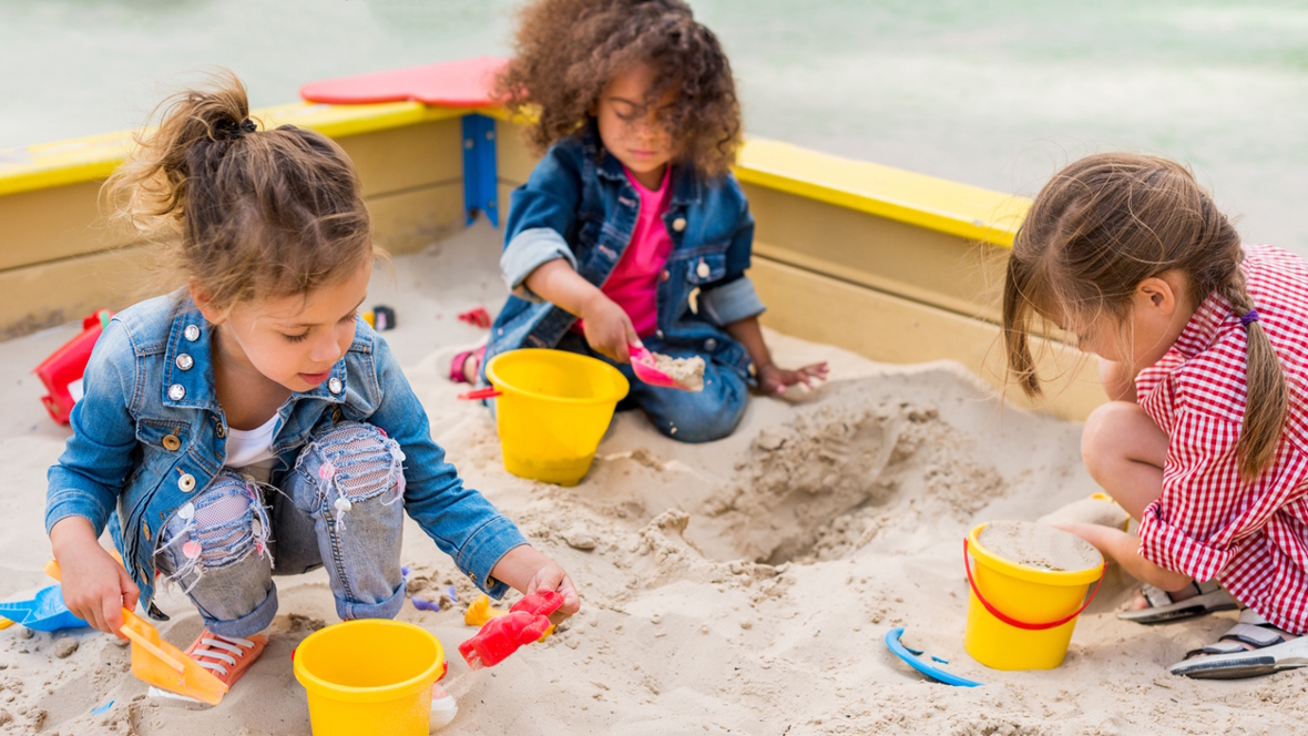 kids digging in a sandbox