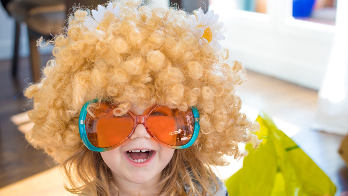 little girl playing dress up