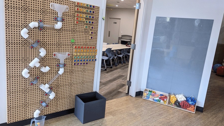 STEM wall at Kids Magic Lab with Lego blocks and other sensory activities