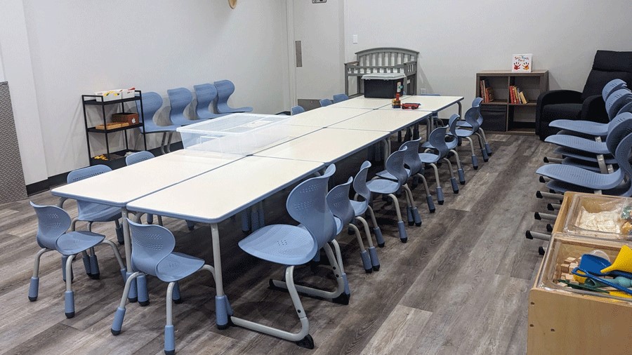Indoor play space with classroom, complete with table and chairs for kids activities