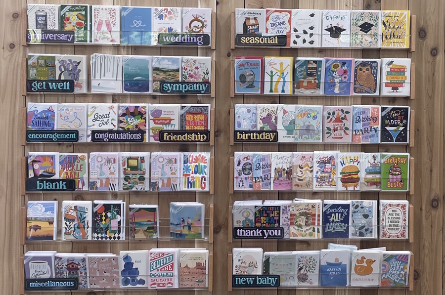 a wall covered in greeting cards at Trader Joe’s