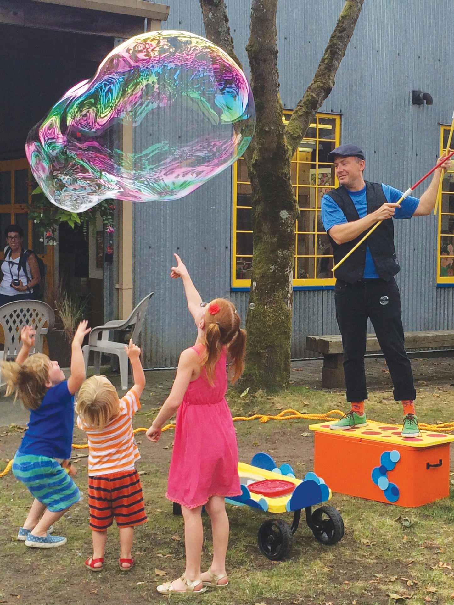 Matt Henry's Big Bubble show. Man blowing a giant bubble for kids.
