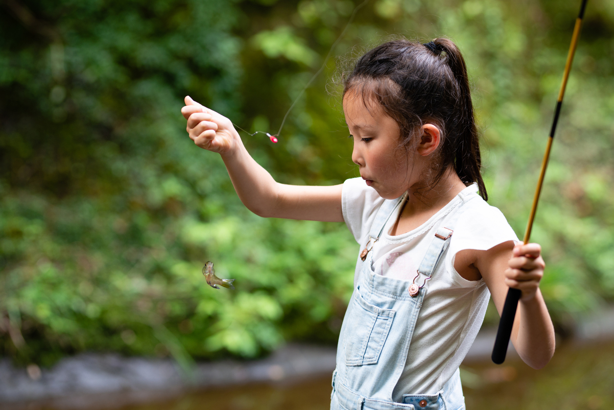 girl with fishing pole very small fish where seattle families can go fishing with kids
