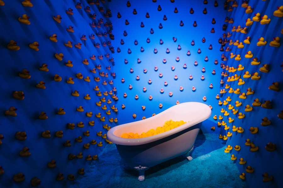 a bath tub filled with rubber duckies