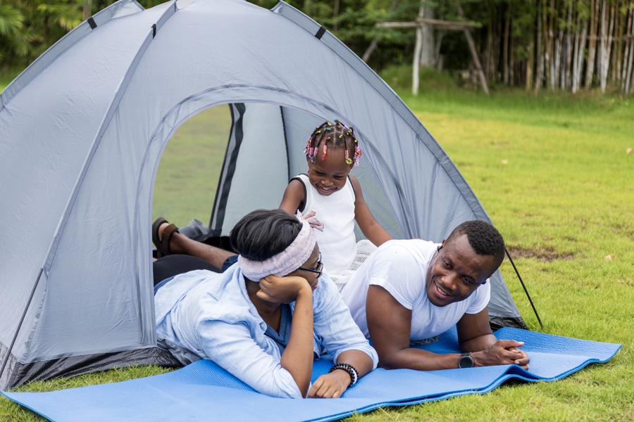 family in a tent in their yard