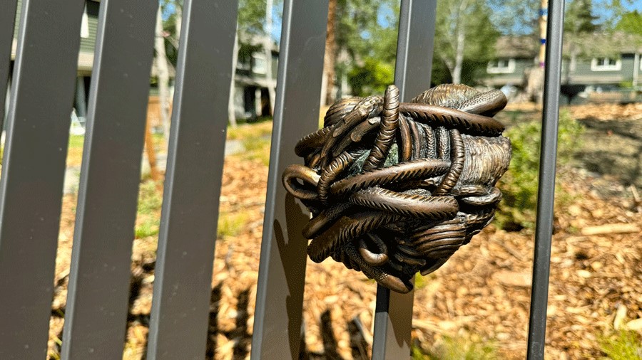 Art sculpture attached to the slats of The Nest at Seattle’s Pathways Park