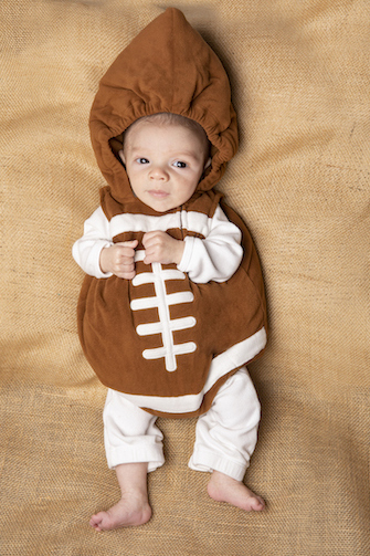 baby dressed up as a football