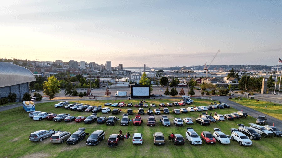 An outdoor summer movie plays near Seattle at America’s Car Museum